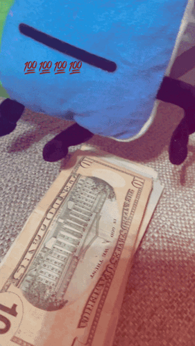 A Stack Of 10 Dollar Bills Next To A Blue Pillow With 100 100 100 100 Written On It GIF
