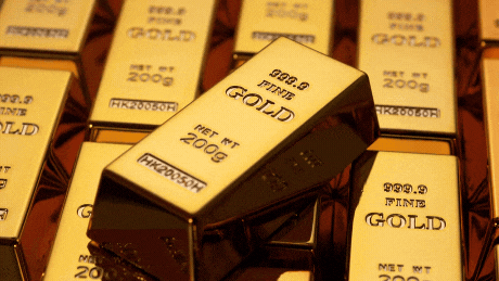 A Stack Of Gold Bars Including One From 2008 GIF