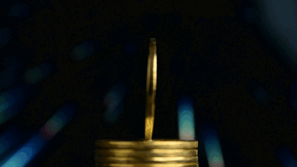 A Stack Of Gold Coins With The Words Btc And Moneytalks On The Bottom GIF