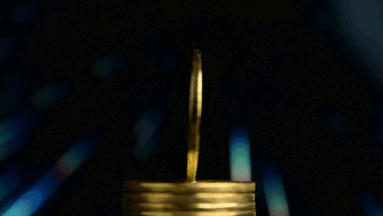 A Stack Of Gold Coins With The Words Btc Moneytalks 199K In The Background GIF