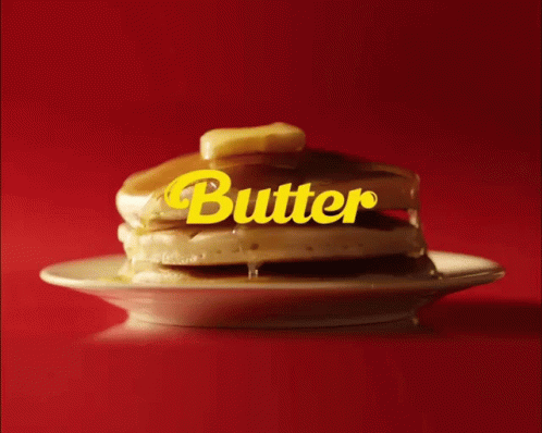 A Stack Of Pancakes On A Plate With The Word Butter Written On It GIF