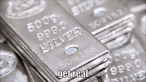 A Stack Of Silver Bars With The Words Get Real On The Bottom Right GIF