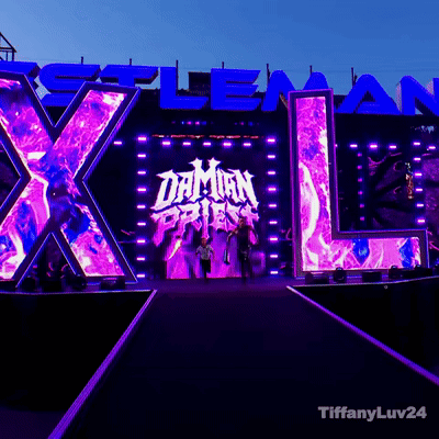 A Stage With A Large X And L And The Word Daman On It GIF