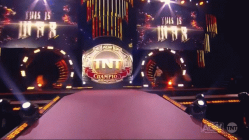A Stage With A Tnt Champion Ring In The Center GIF