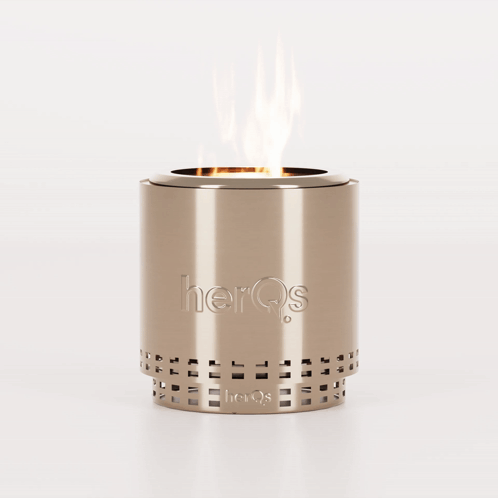 A Stainless Steel Candle Holder With The Word Herqs On It GIF