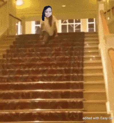 A Staircase With A Picture Of A Woman On It GIF