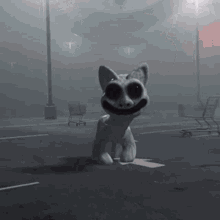 A Statue Of A Cat With Big Eyes Is Sitting On A Box In A Parking Lot . GIF