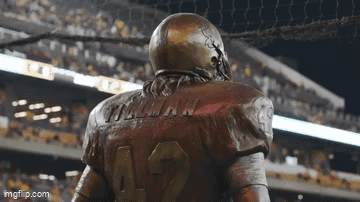 a statue of a football player wearing the number 12