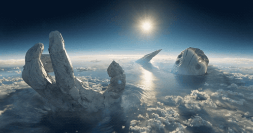 A Statue Of A Hand Reaching Into The Sky GIF