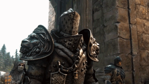 A Statue Of A Knight With A Lion Head On His Armor GIF