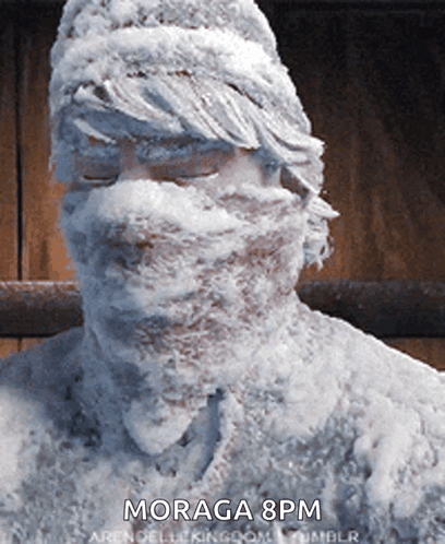 A Statue Of A Man Covered In Snow With The Time Moraga 8Pm GIF