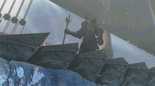 A Statue Of A Man Holding A Trident In A Snowy Area GIF
