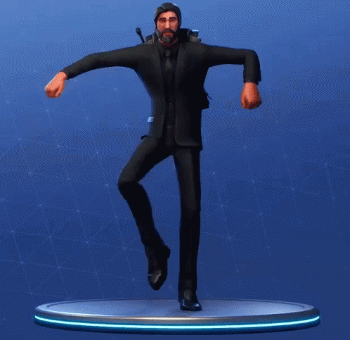 A Statue Of A Man In A Suit And Tie Is Dancing GIF
