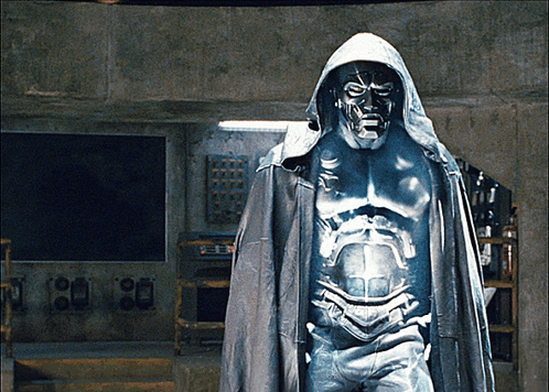 A Statue Of A Man Wearing A Hooded Cape And A Mask GIF