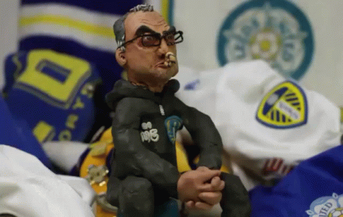 A Statue Of A Man Wearing Glasses And A Hoodie That Says 108 GIF