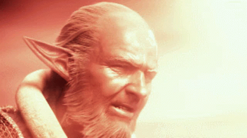 A Statue Of A Man With A Beard And Ears GIF