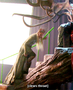 A Statue Of A Man With A Crown On His Head And The Words Clears Throat On The Bottom GIF