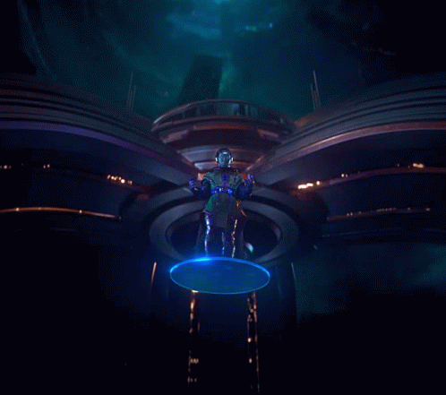 A Statue Of A Man With Blue Eyes Is Surrounded By Blue Lights GIF