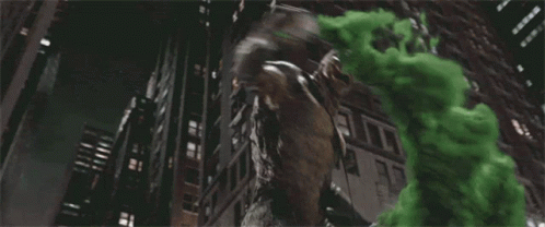 A Statue Of A Monster Is Surrounded By Green Smoke Coming Out Of It 'S Mouth . GIF