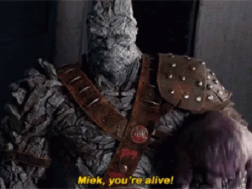 A Statue Of A Monster Says " Miek You 'Re Alive ! " GIF