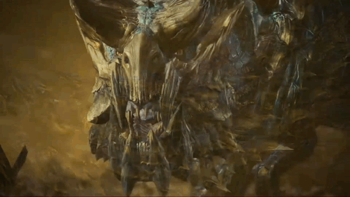 a statue of a monster with horns and a face