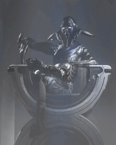 A Statue Of A Robot Sitting On A Throne GIF