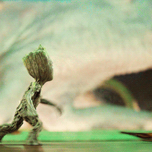 Tree Statue With Large Trunk On Head GIF