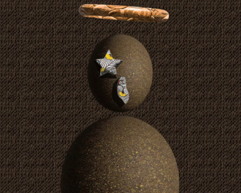 A Statue Of An Egg With A Cross On It 'S Eye GIF