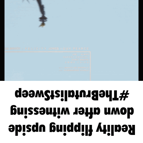 A Statue Of Liberty Is Hanging Upside Down On A Blue Background GIF