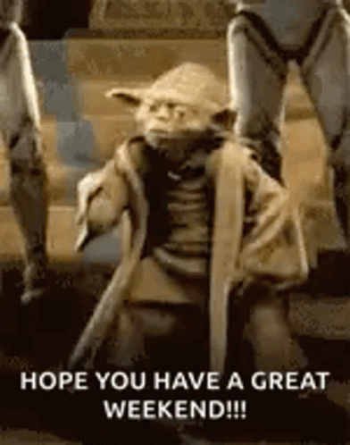 A Statue Of Yoda From Star Wars Is Kneeling Down On The Ground . GIF
