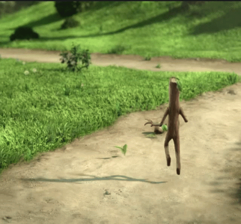 A Stick With Legs Is Walking On A Dirt Road GIF