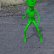 A Stop Sign With A Green Alien In Front Of It GIF
