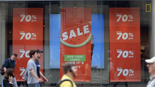 A Store Front With A Sign That Says Sale Up To 70 Percent Off GIF