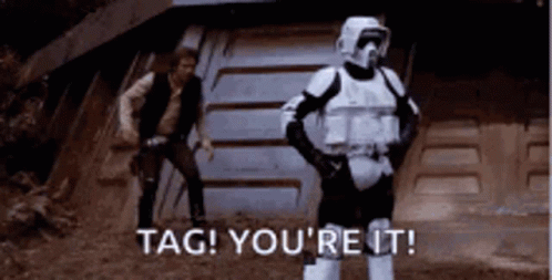 A Storm Trooper Is Standing In Front Of Han Solo . GIF