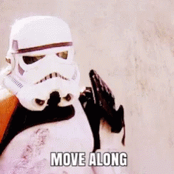 A Stormtrooper From Star Wars Is Holding A Gun And Says Move Along . GIF