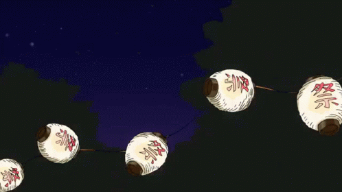 A String Of White Lanterns With Chinese Characters On Them GIF