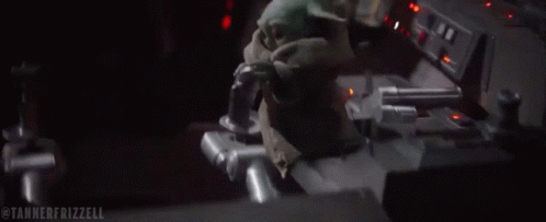 A Stuffed Animal Is Sitting In The Driver 'S Seat Of A Car . GIF