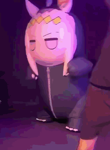 A Stuffed Animal That Looks Like A Rabbit With Horns Is Dancing On A Stage GIF