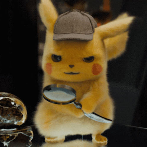 A Stuffed Animal Wearing A Detective Hat Holds A Magnifying Glass GIF