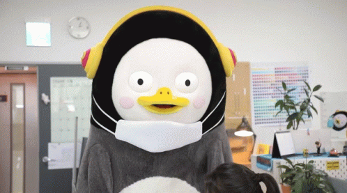 A Stuffed Animal Wearing A Mask And Headphones GIF