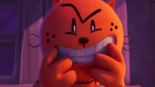 A Stuffed Animal With A Big Smile On Its Face Is Making A Funny Face . GIF