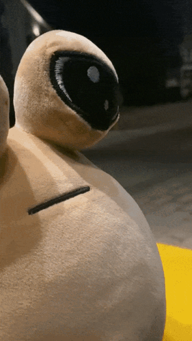 A Stuffed Animal With A Black Eye And A White Nose GIF