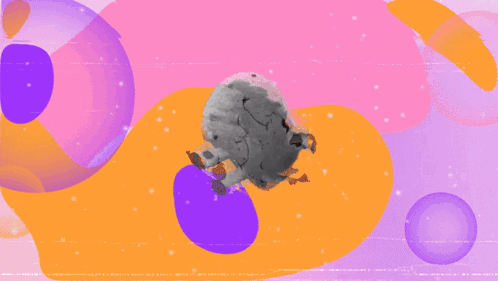 A Stuffed Animal With A Smiley Face And Black Spots On It GIF