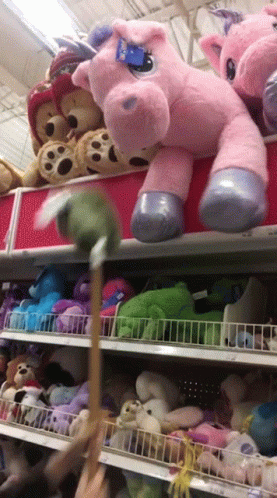 A Stuffed Animal With A Tag That Says Build A Bear On It GIF
