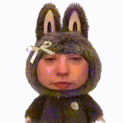 A Stuffed Animal With Bunny Ears And A Bow GIF