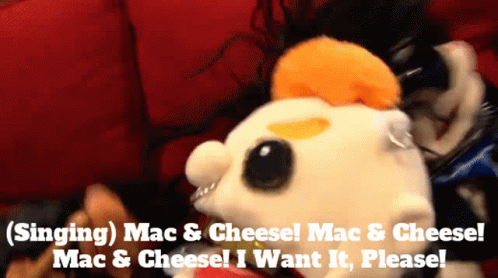 A Stuffed Animal With The Words Singing Mac & Cheese On It GIF