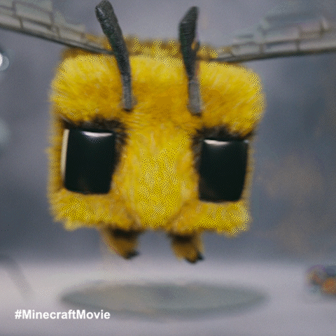 A Stuffed Bee From The Minecraft Movie Flying In The Air GIF