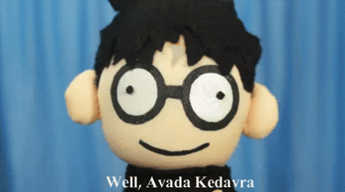 A Stuffed Harry Potter Doll Says Well Avada Kedavra In Front Of A Blue Background GIF