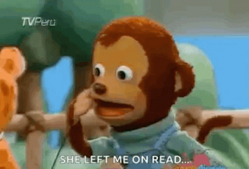 A Stuffed Monkey Is Talking On A Cell Phone While Standing Next To A Giraffe . GIF