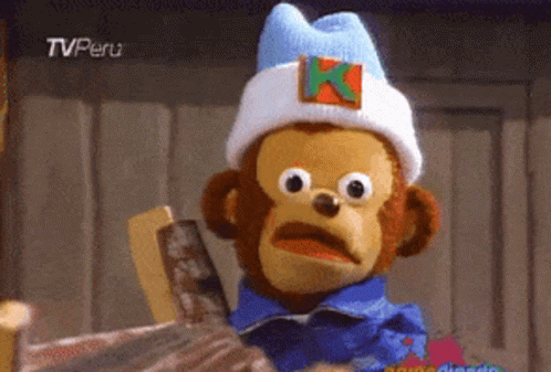 A Stuffed Monkey Wearing A White Hat With A K On It GIF